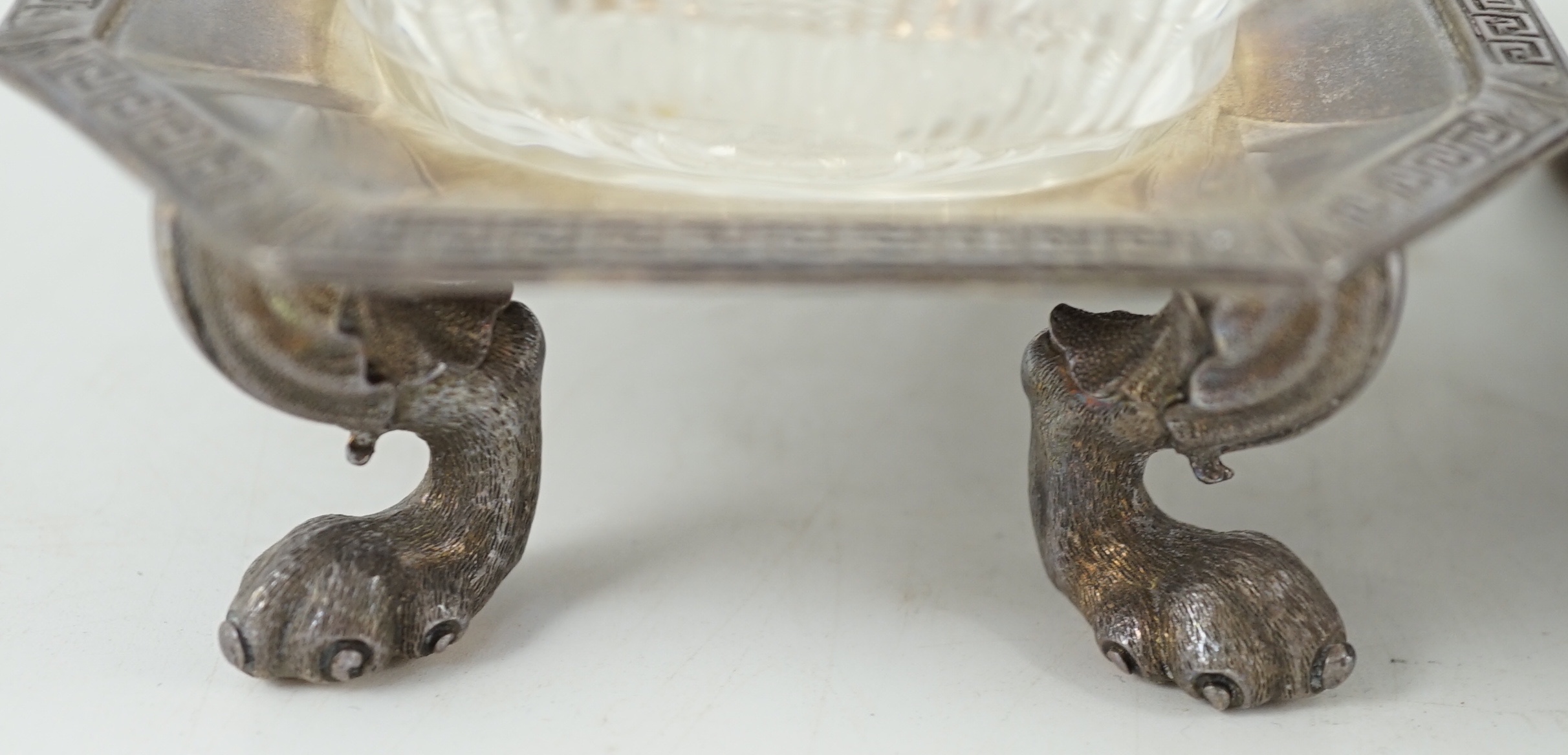 A pair of George V silver salt cellars, with cut glass liners